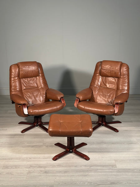 A Pair Of Daneway Swivel Recliner Armchairs And Stool