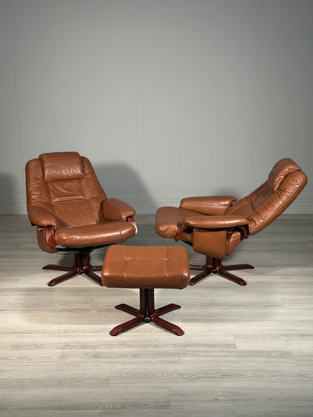 A Pair Of Daneway Swivel Recliner Armchairs And Stool
