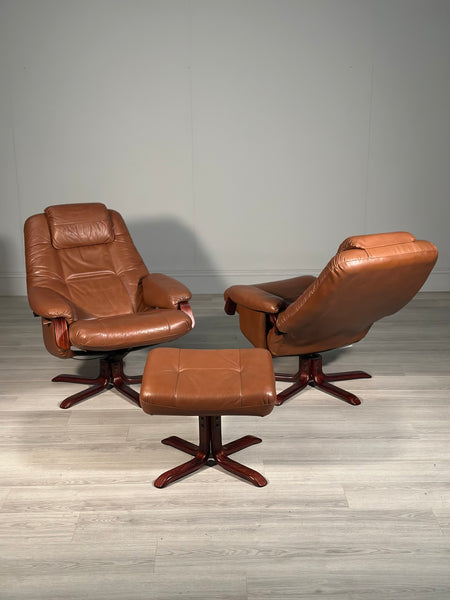 A Pair Of Daneway Swivel Recliner Armchairs And Stool