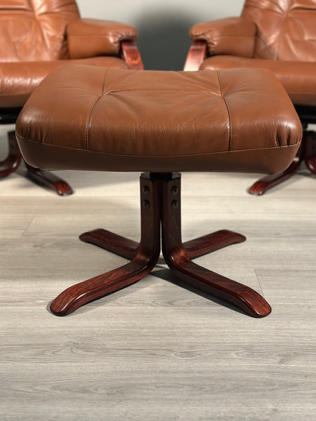 A Pair Of Daneway Swivel Recliner Armchairs And Stool