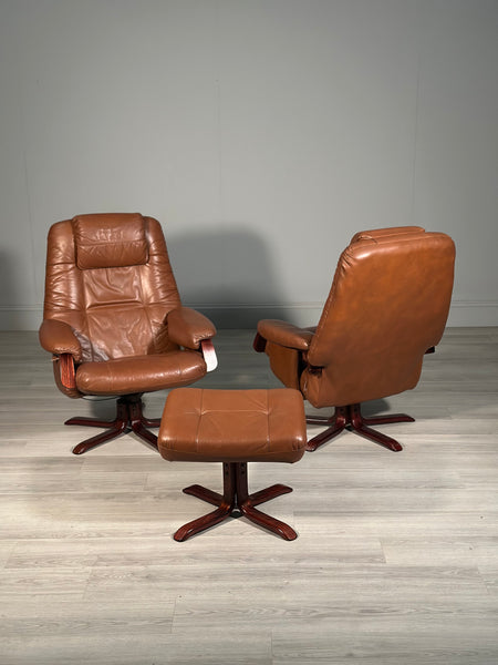 A Pair Of Daneway Swivel Recliner Armchairs And Stool
