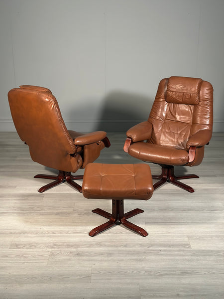 A Pair Of Daneway Swivel Recliner Armchairs And Stool