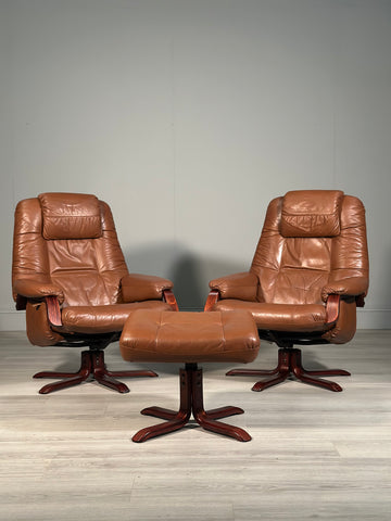 A Pair Of Daneway Swivel Recliner Armchairs And Stool