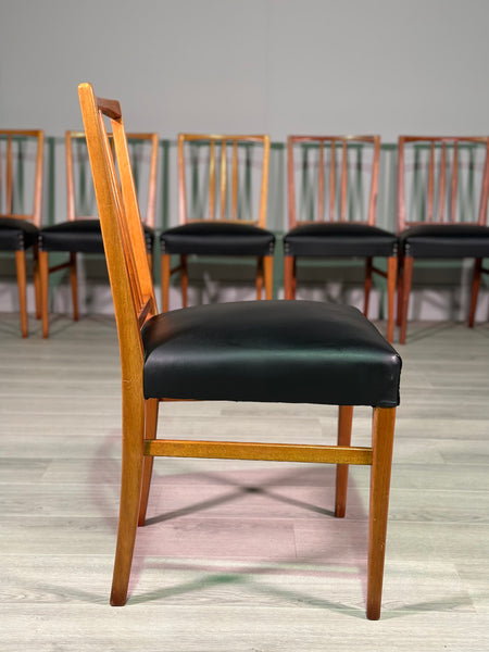 A Set Of 8 Gordon Russell Teak Dining Chairs